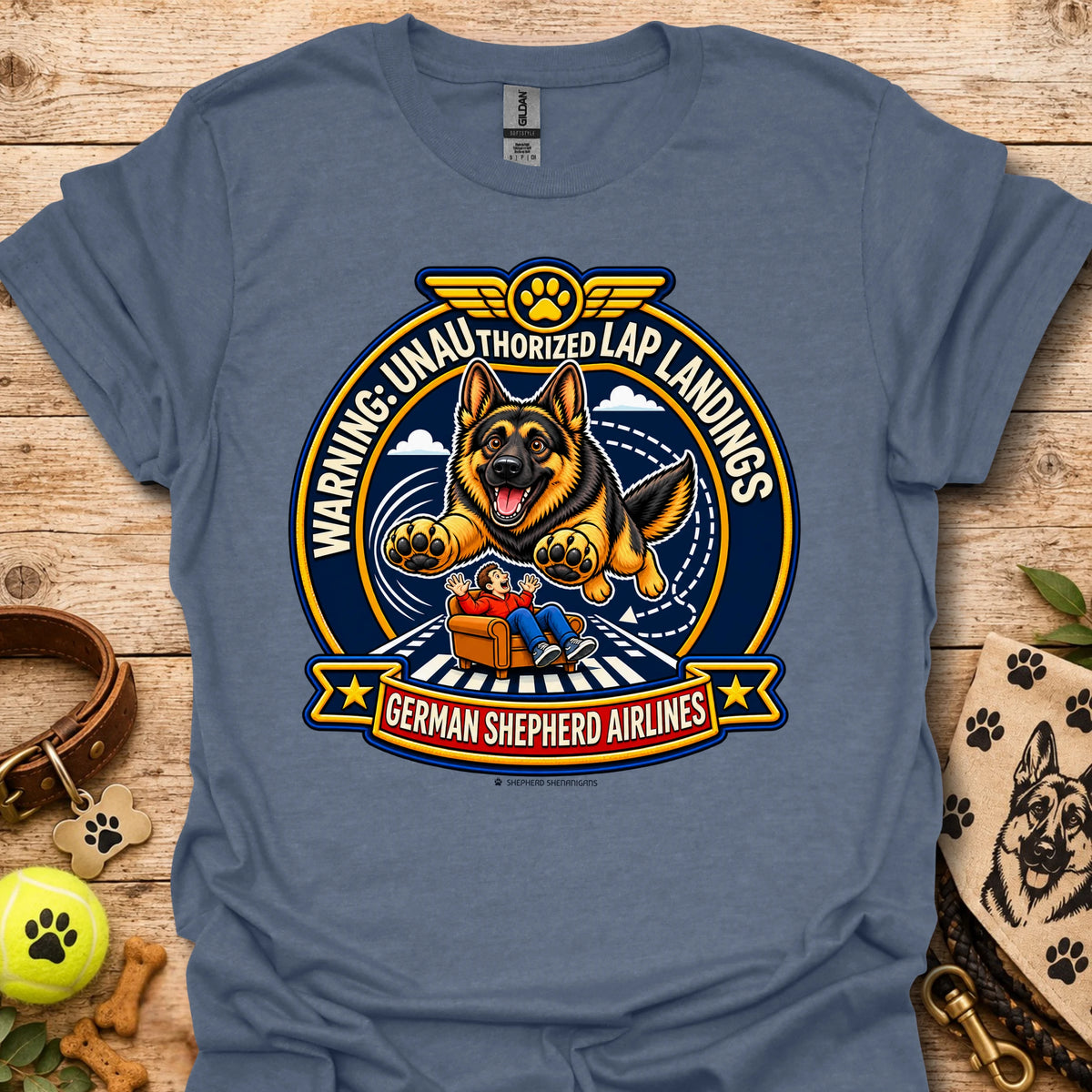 Heather blue T-shirt with a German shepherd airline badge graphic and lap-landing warning