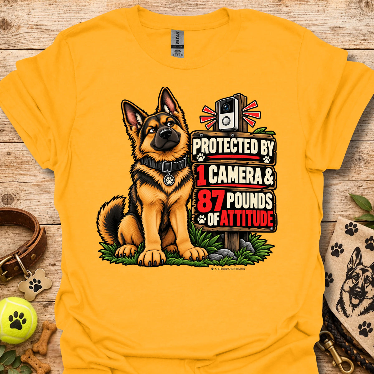 Graphic dog t-shirt in gold, front print of a sitting German shepherd dog
