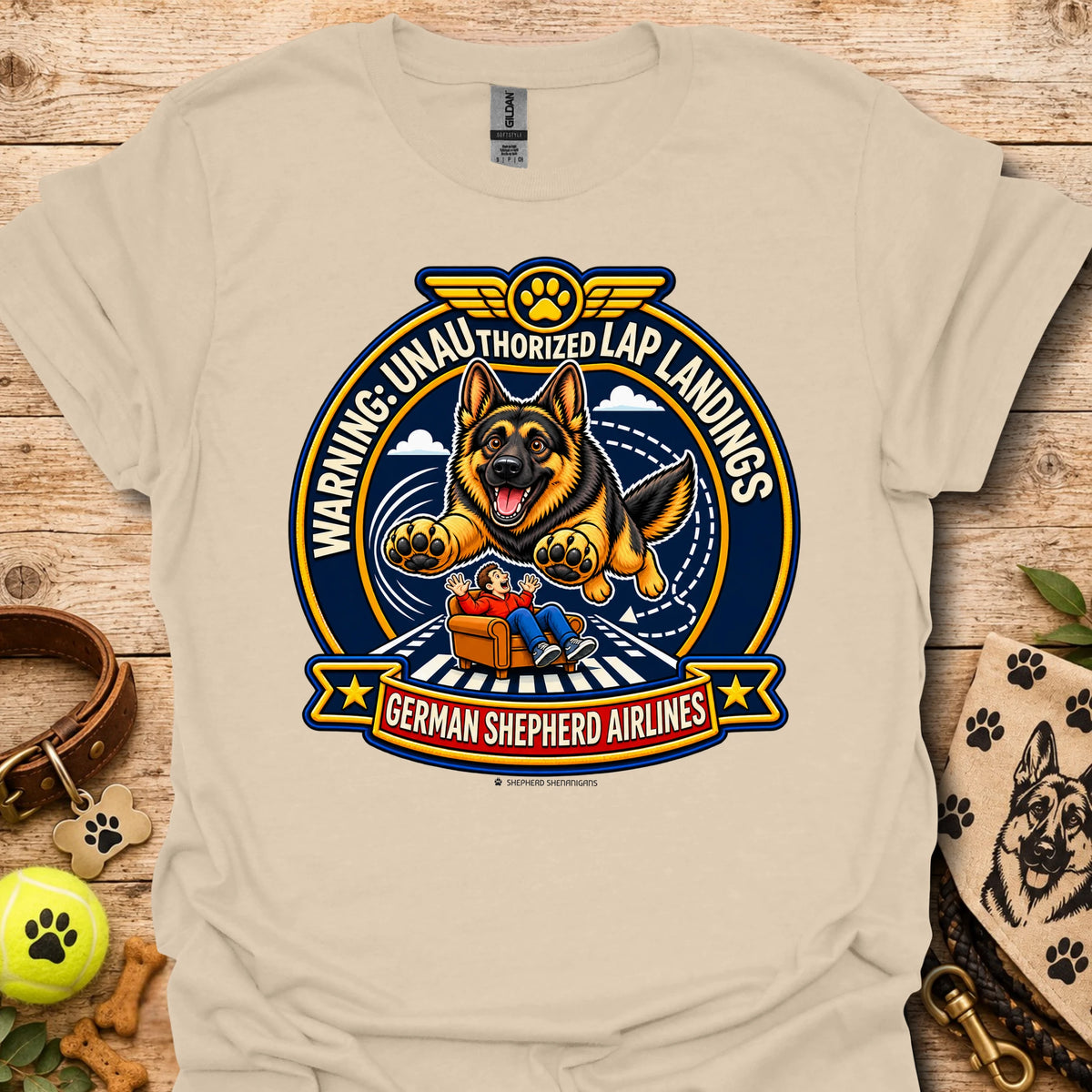 Sand T-shirt with a German shepherd airline badge graphic and lap-landing warning