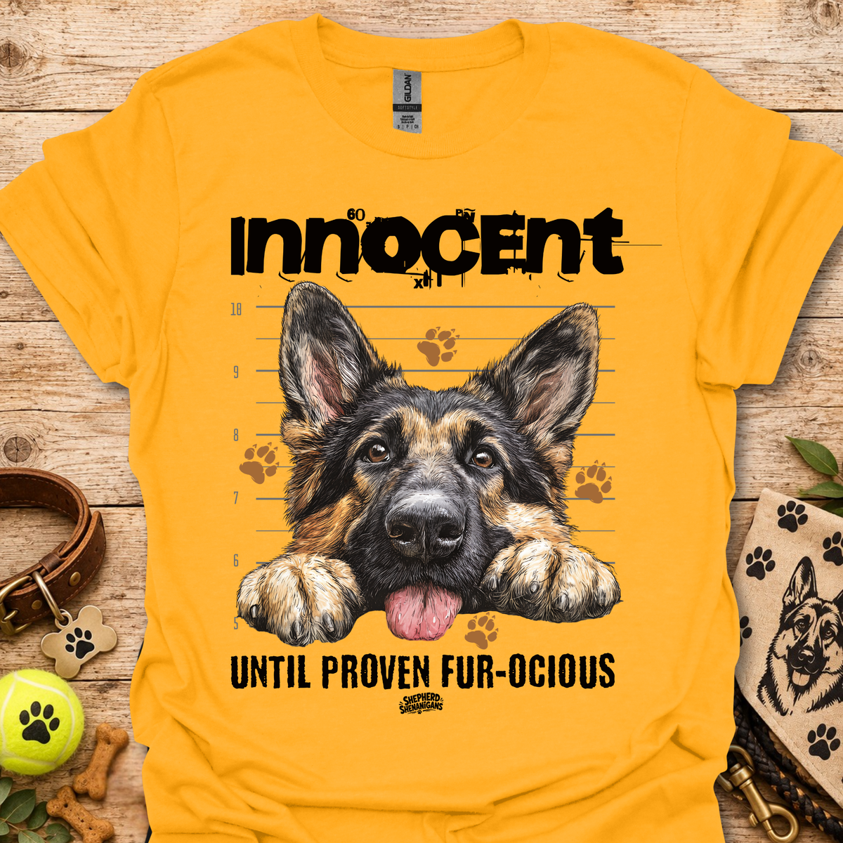 Gold T-shirt with German shepherd graphic and "Until Proven Fur-ocious" slogan