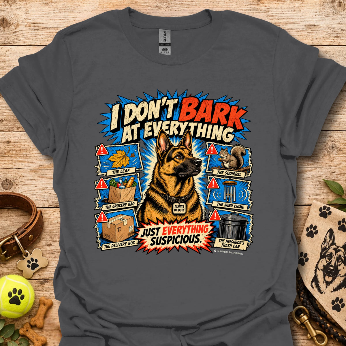Dark charcoal T-shirt with colorful comic dog graphic and bold slogan print