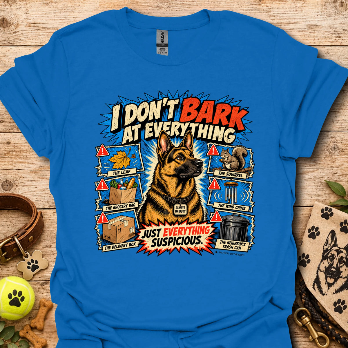 Bright blue T-shirt with colorful comic dog graphic and bold slogan print