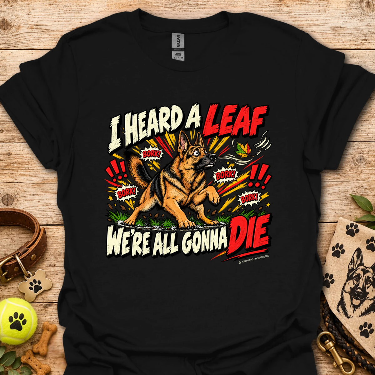 Black crew-neck T-shirt with colorful dog-and-leaf front graphic, short sleeves
