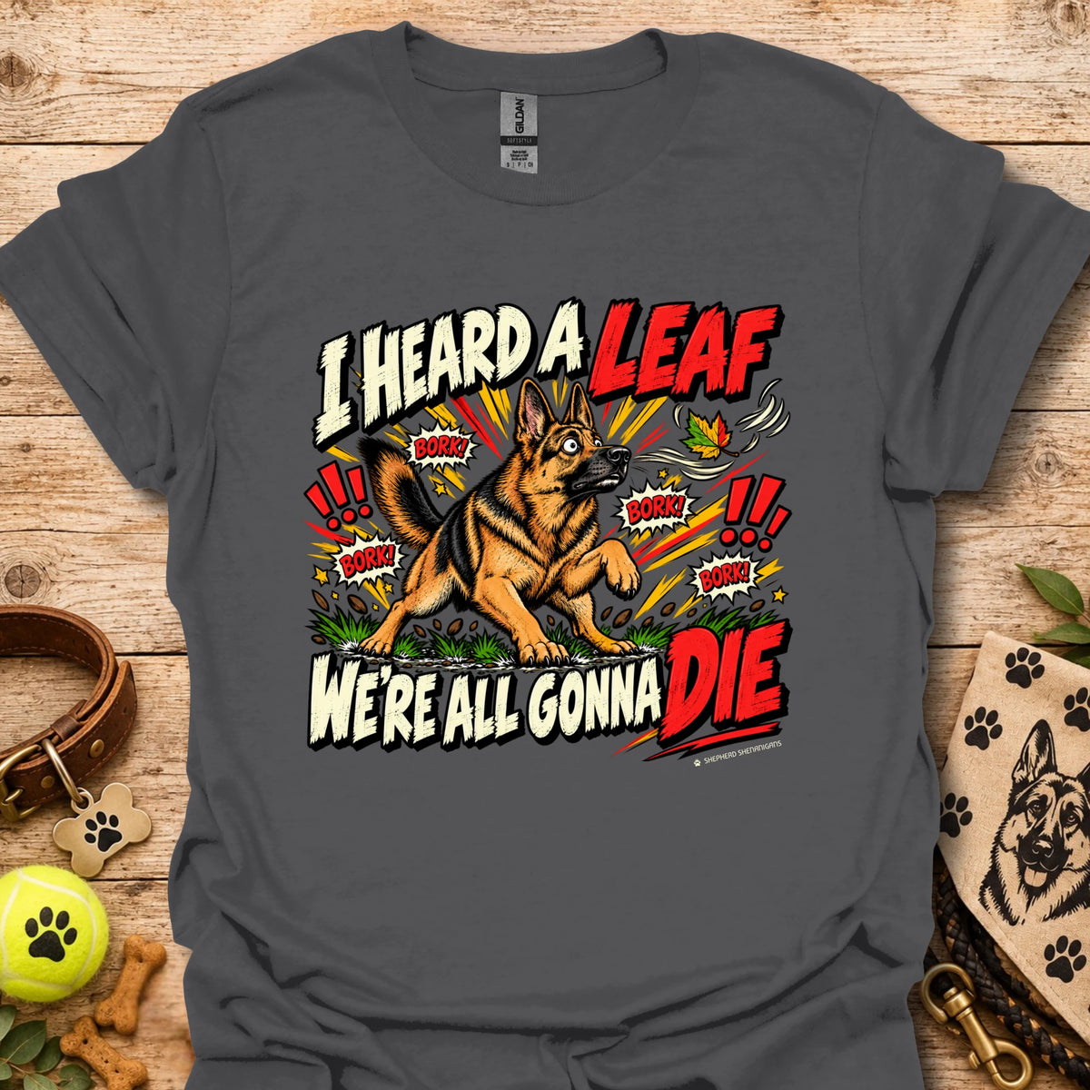 Charcoal gray crew-neck T-shirt with colorful dog-and-leaf front graphic, short sleeves