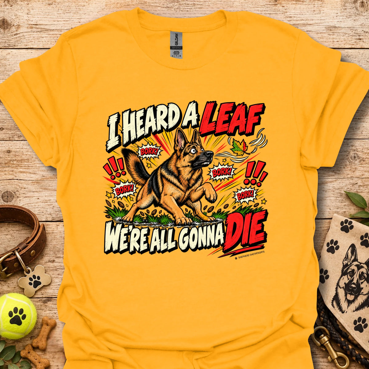 Yellow crew-neck T-shirt with colorful dog-and-leaf front graphic, short sleeves
