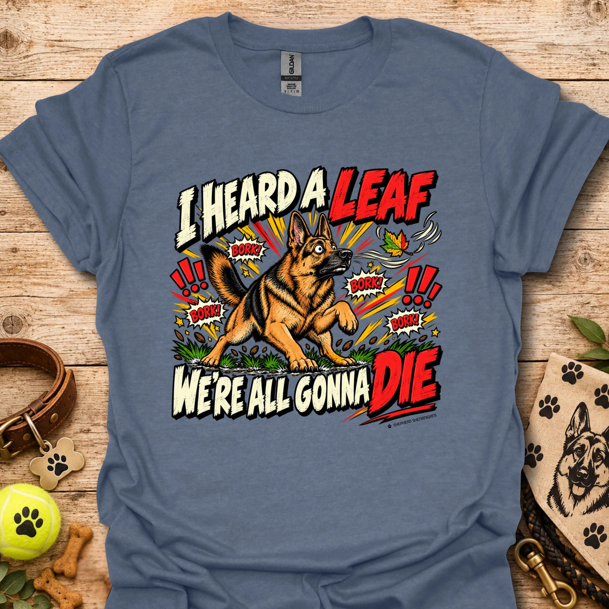 Navy blue crew-neck T-shirt with colorful dog-and-leaf front graphic, short sleeves