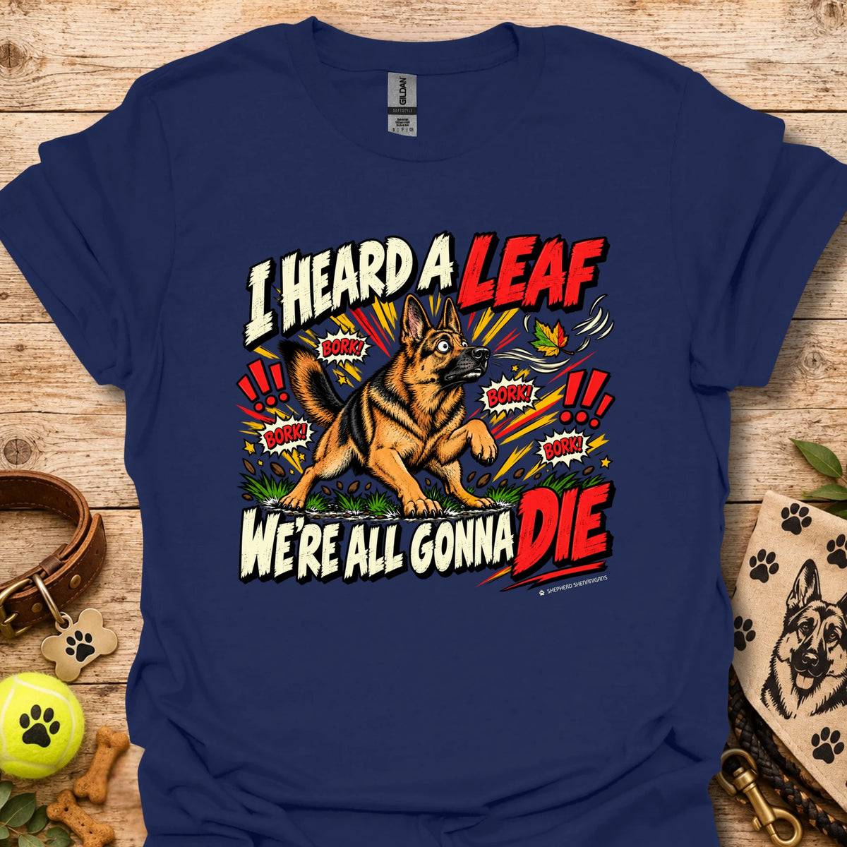 Royal blue crew-neck T-shirt with colorful dog-and-leaf front graphic, short sleeves