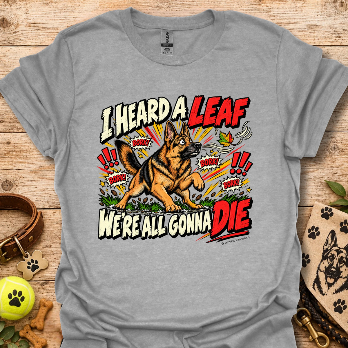 Light gray crew-neck T-shirt with colorful dog-and-leaf front graphic, short sleeves