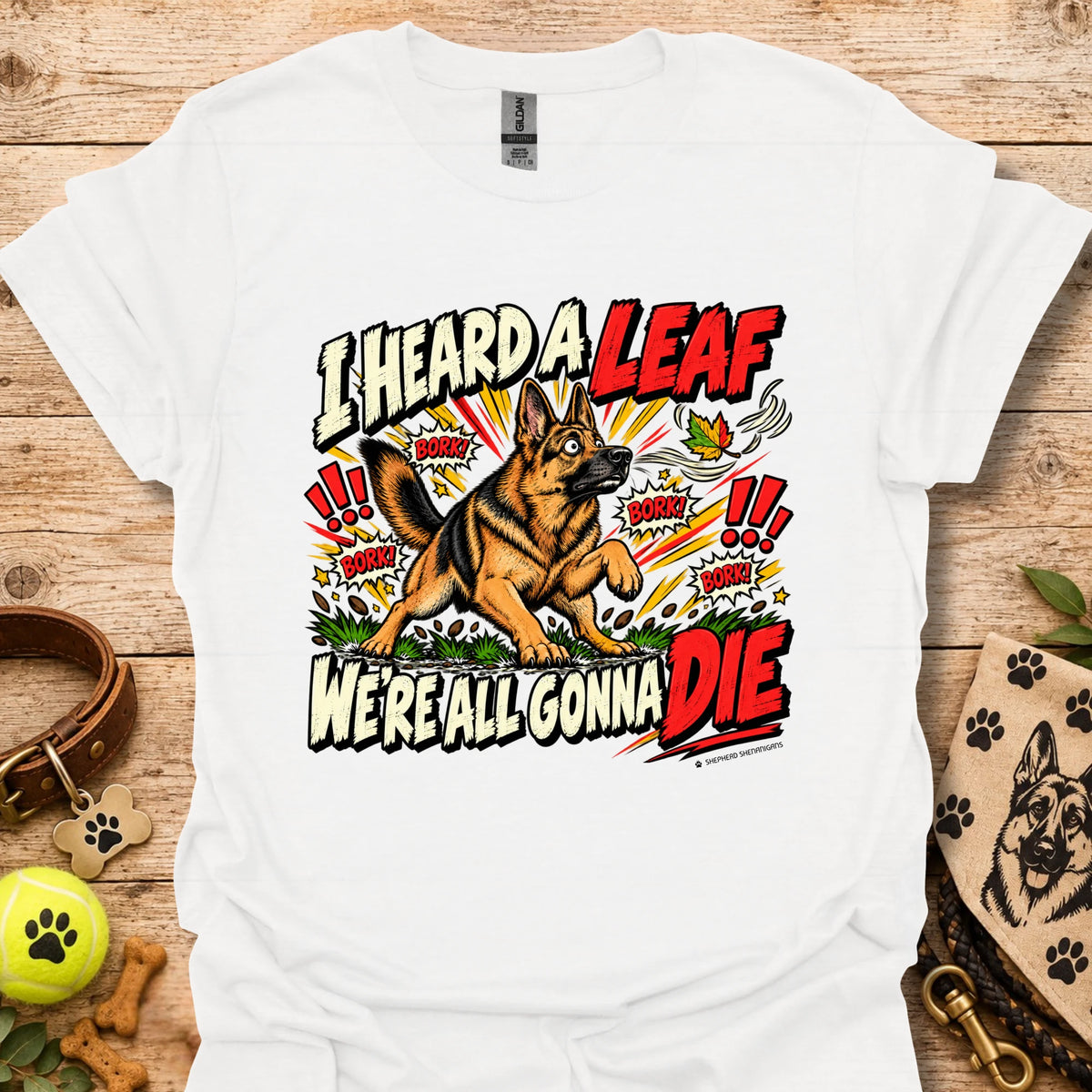 White crew-neck T-shirt with colorful dog-and-leaf front graphic, short sleeves