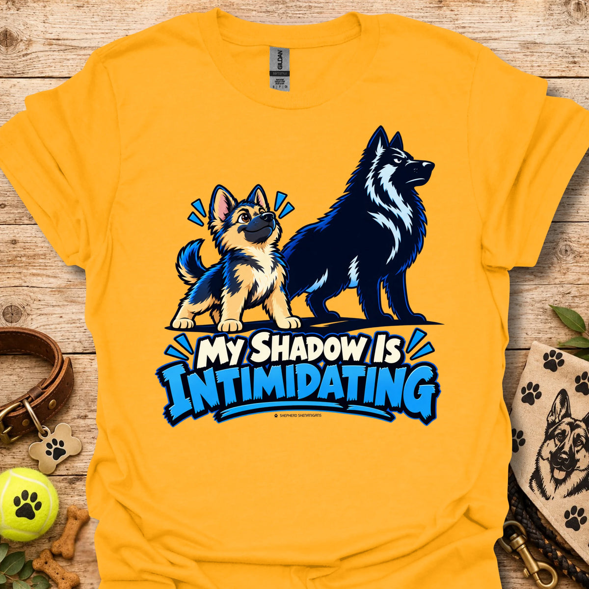 Mustard/yellow t-shirt with wolf dog graphic and blue “My Shadow Is Intimidating” text