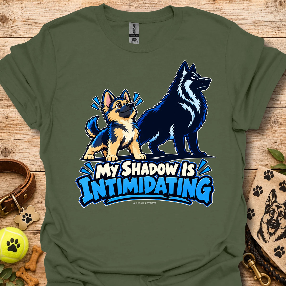 Green t-shirt with wolf dog graphic and blue “My Shadow Is Intimidating” text