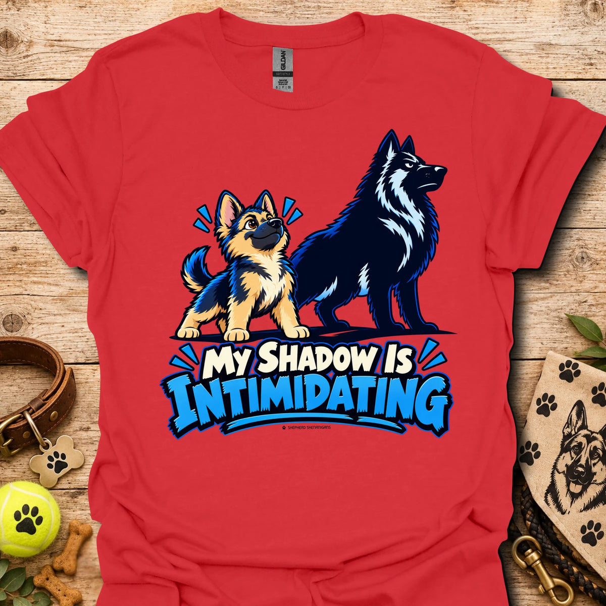 Red t-shirt with wolf dog graphic and blue “My Shadow Is Intimidating” text
