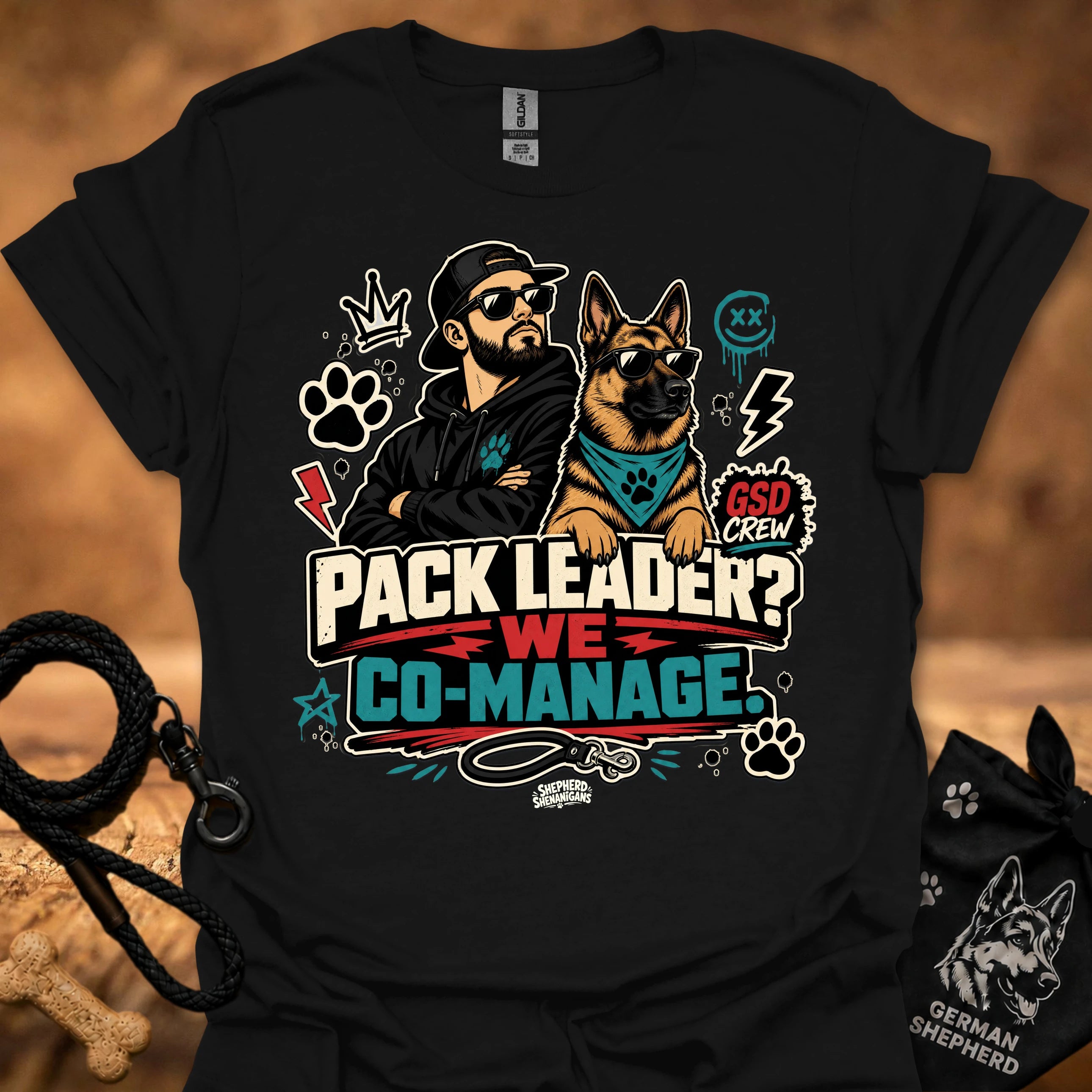 Black crew-neck short-sleeve T-shirt with illustrated dog-and-man graphic and “Co-Manage” text