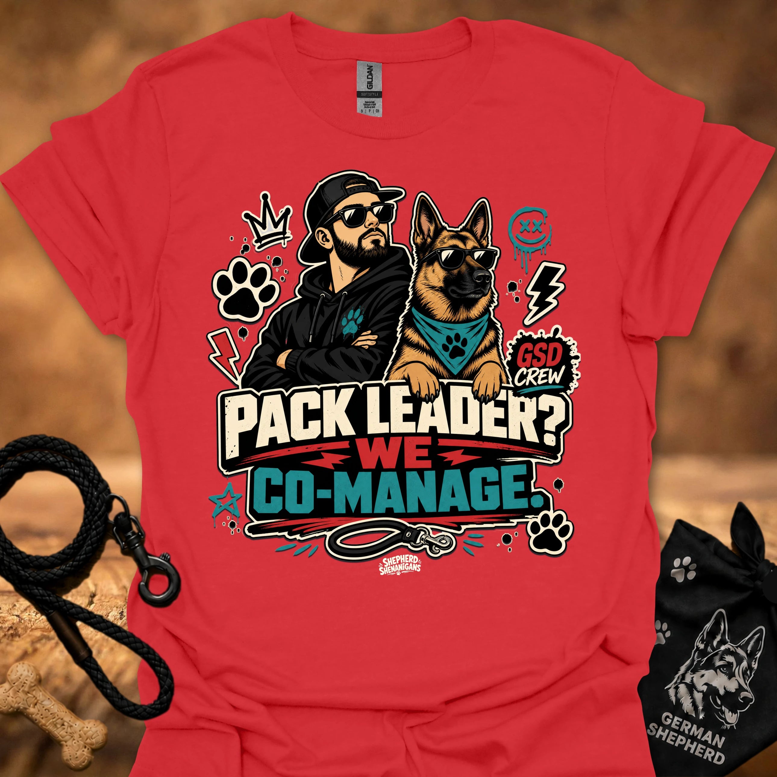 Red crew-neck short-sleeve T-shirt with illustrated dog-and-man graphic and “Co-Manage” text