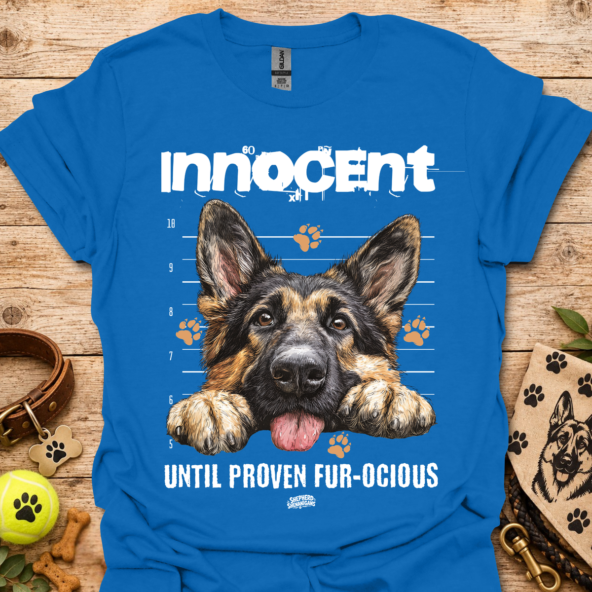 Royal blue T-shirt with German shepherd graphic and "Until Proven Fur-ocious" slogan
