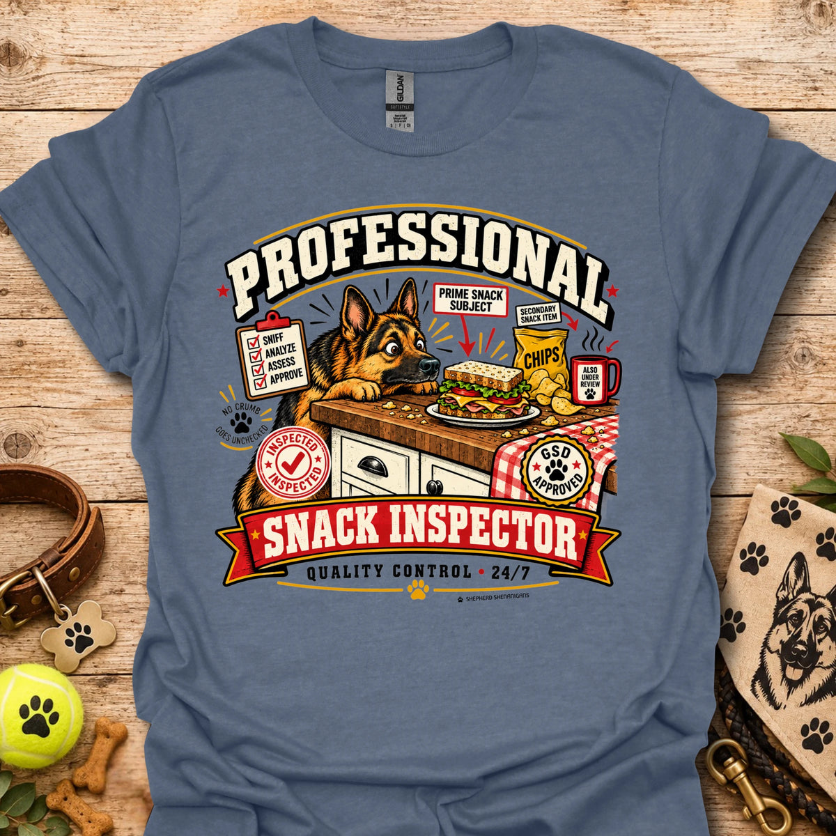 Blue crew-neck T-shirt with large “Professional Snack Inspector” graphic and dog