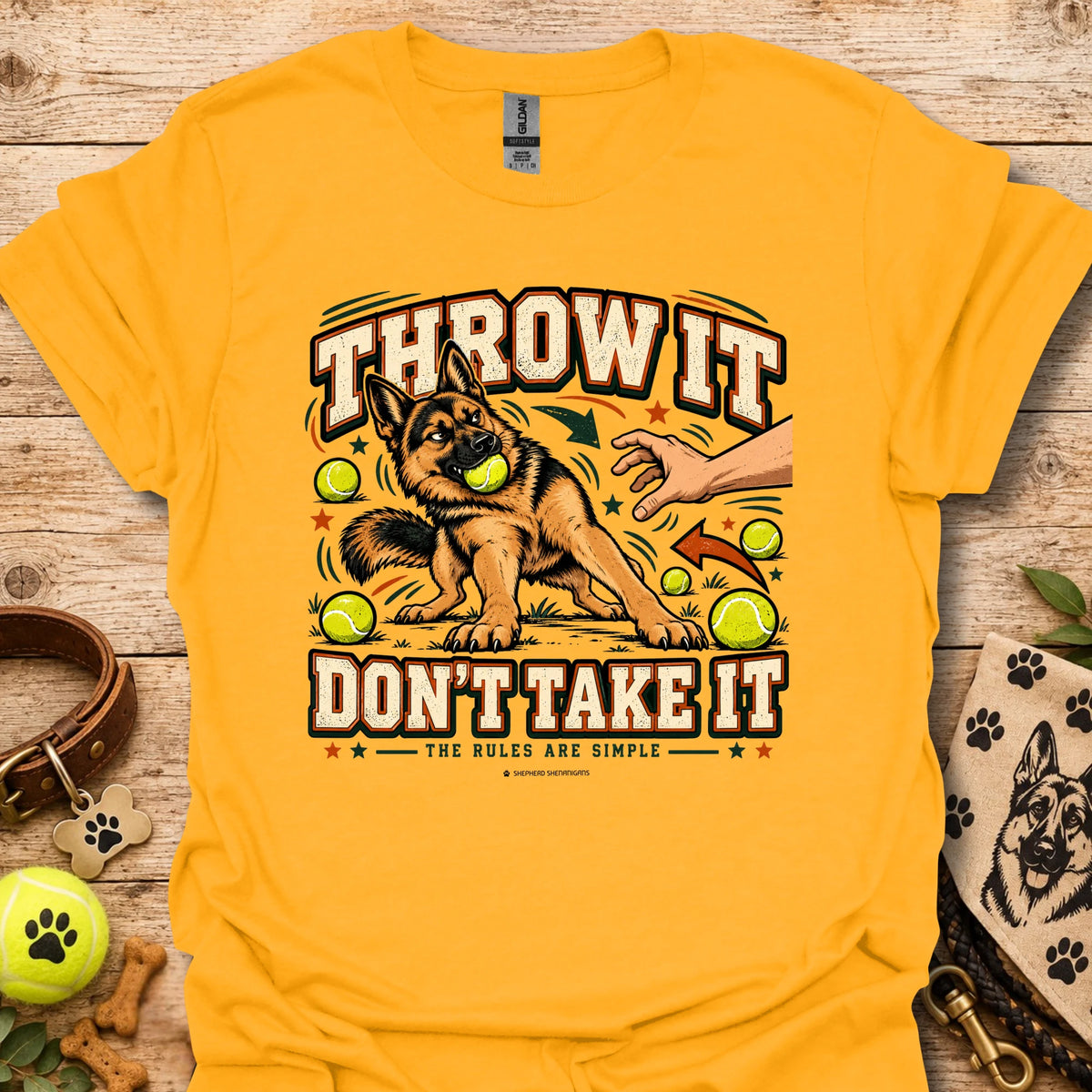 Gold crew-neck T-shirt with “Throw It Don’t Take It” dog graphic