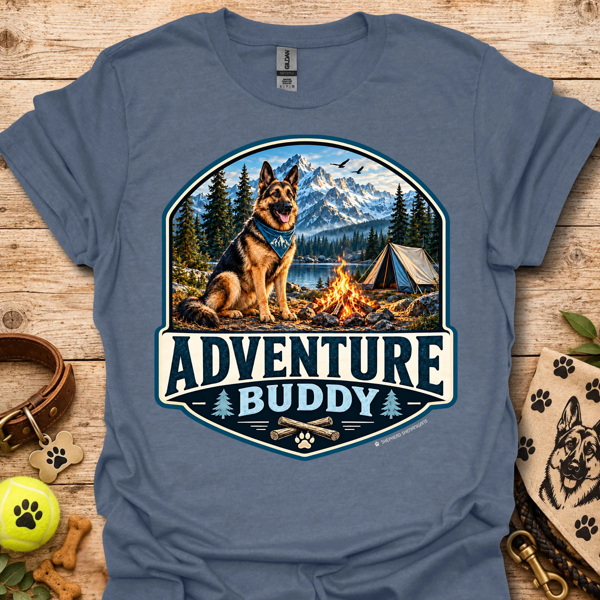 Slate blue t-shirt with badge-style camping dog graphic and adventure lettering