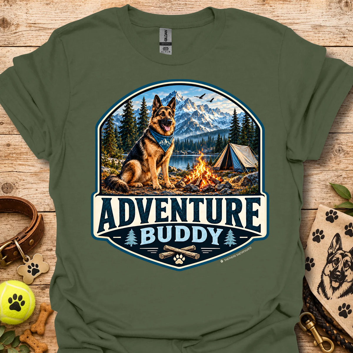 Olive green t-shirt with badge-style camping dog graphic and adventure lettering