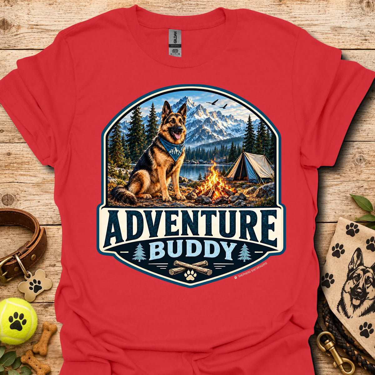 Red t-shirt with badge-style camping dog graphic and adventure lettering