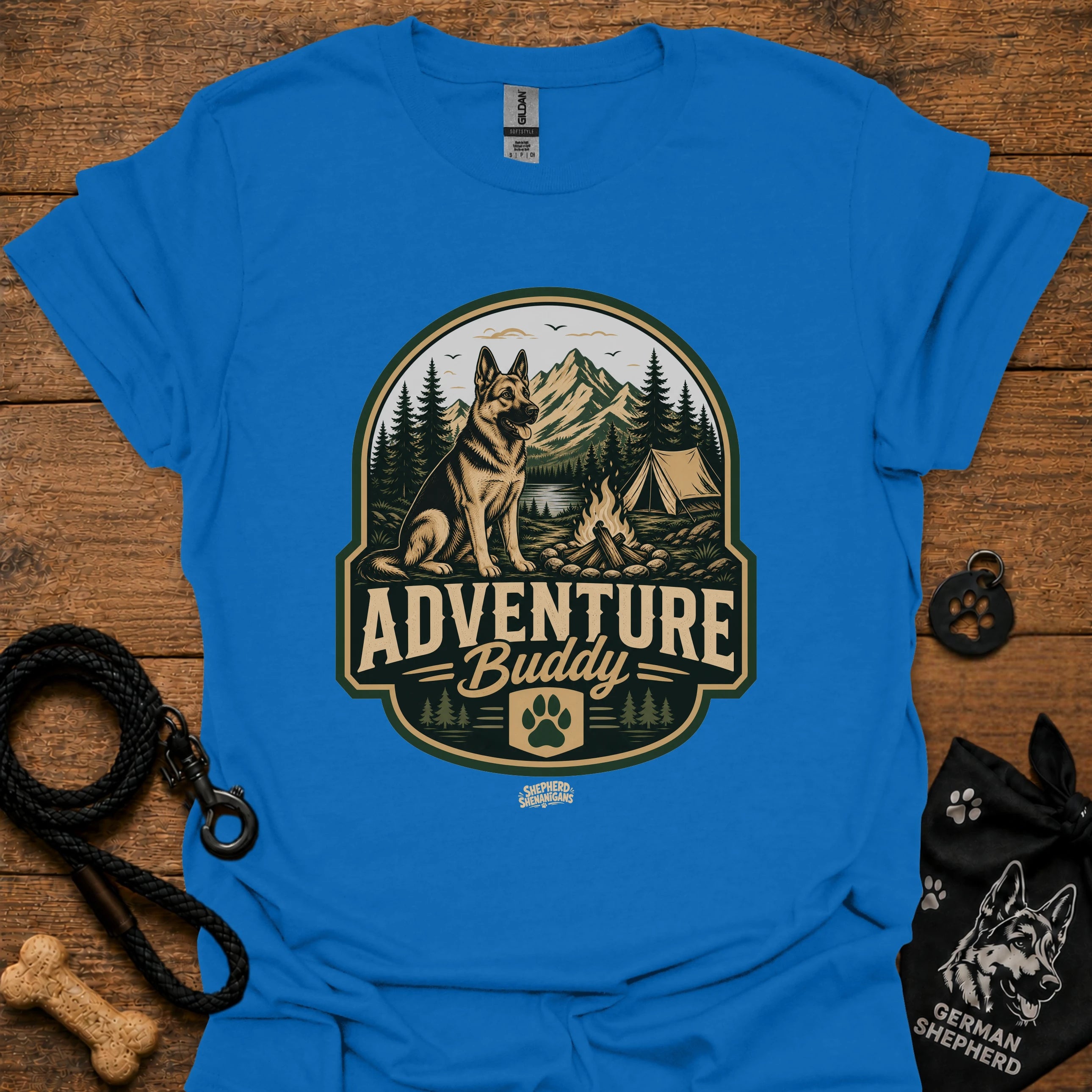 Royal blue dog adventure graphic T-shirt with round “Adventure Buddy” logo
