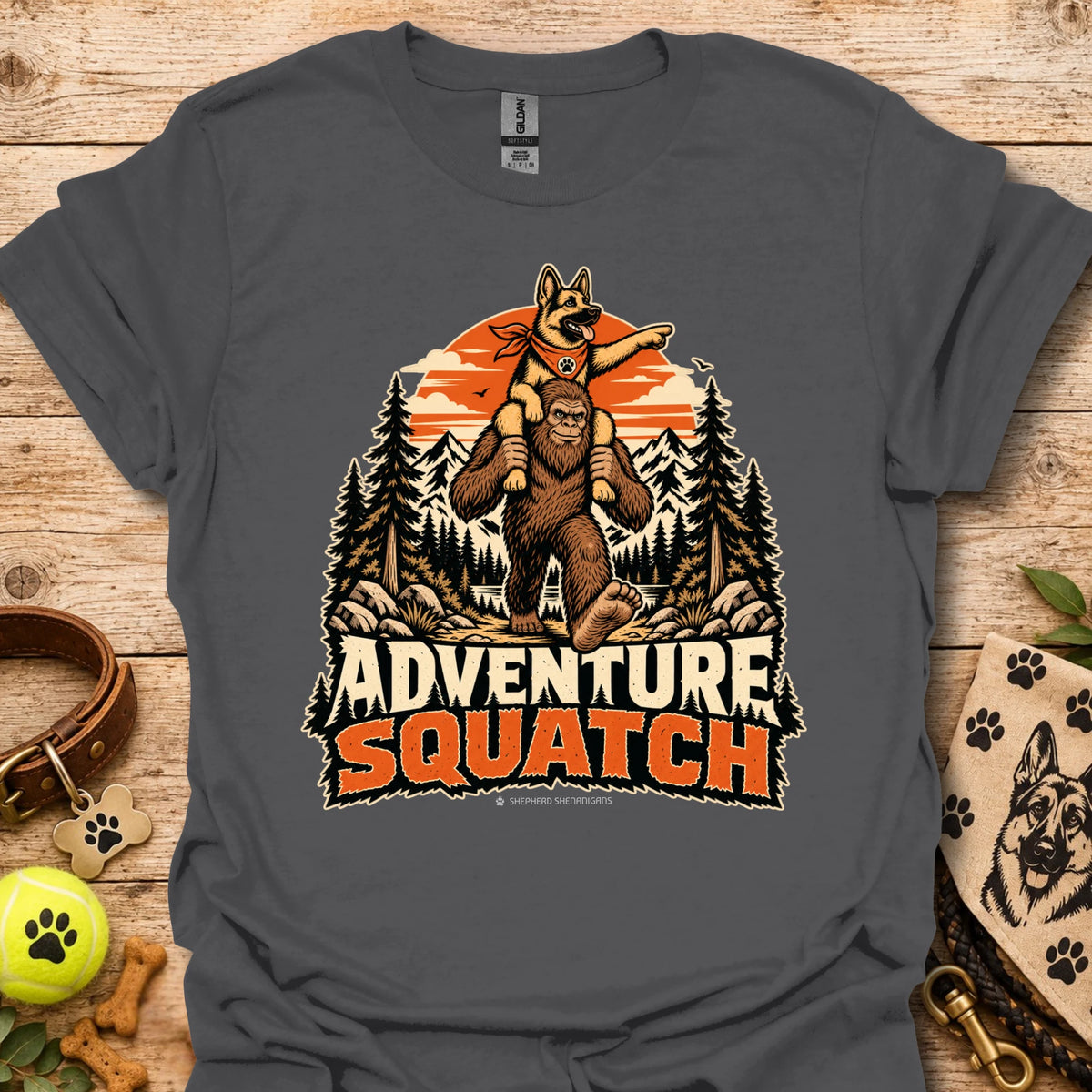 Dark gray T-shirt with orange bear and pine tree logo graphic centered on the chest