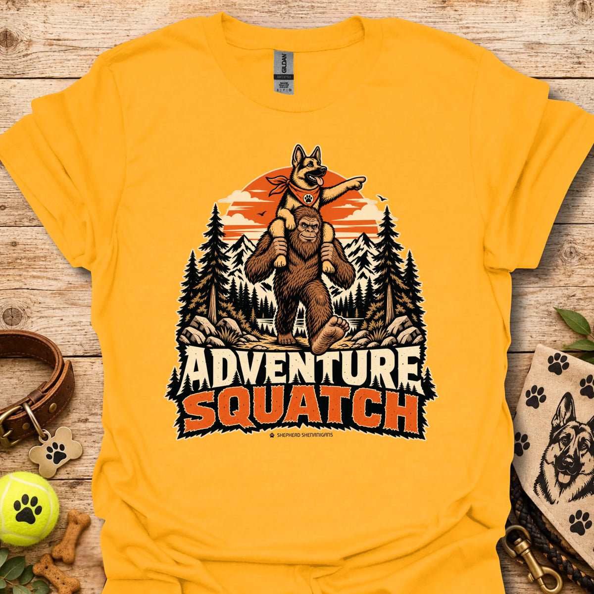 Yellow T-shirt with orange bear and pine tree logo graphic centered on the chest