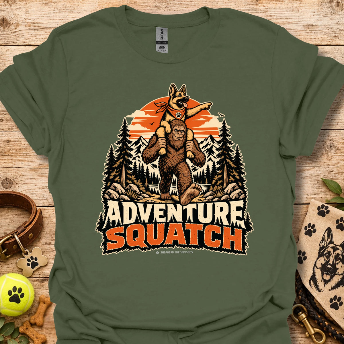 Green T-shirt with orange bear and pine tree logo graphic centered on the chest
