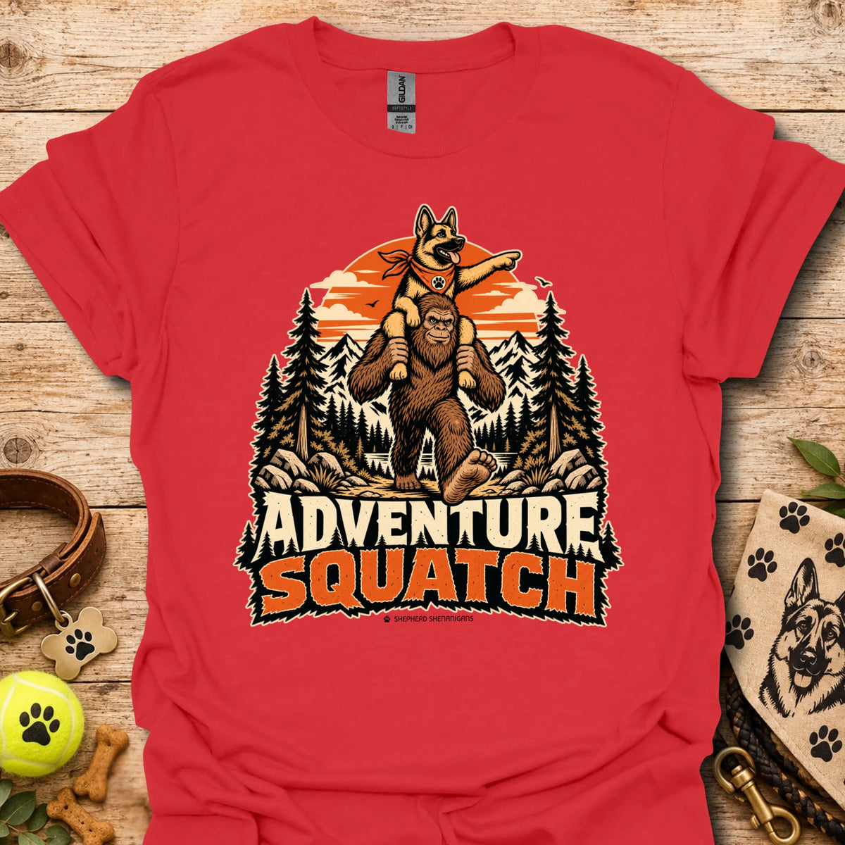 Red T-shirt with orange bear and pine tree logo graphic centered on the chest