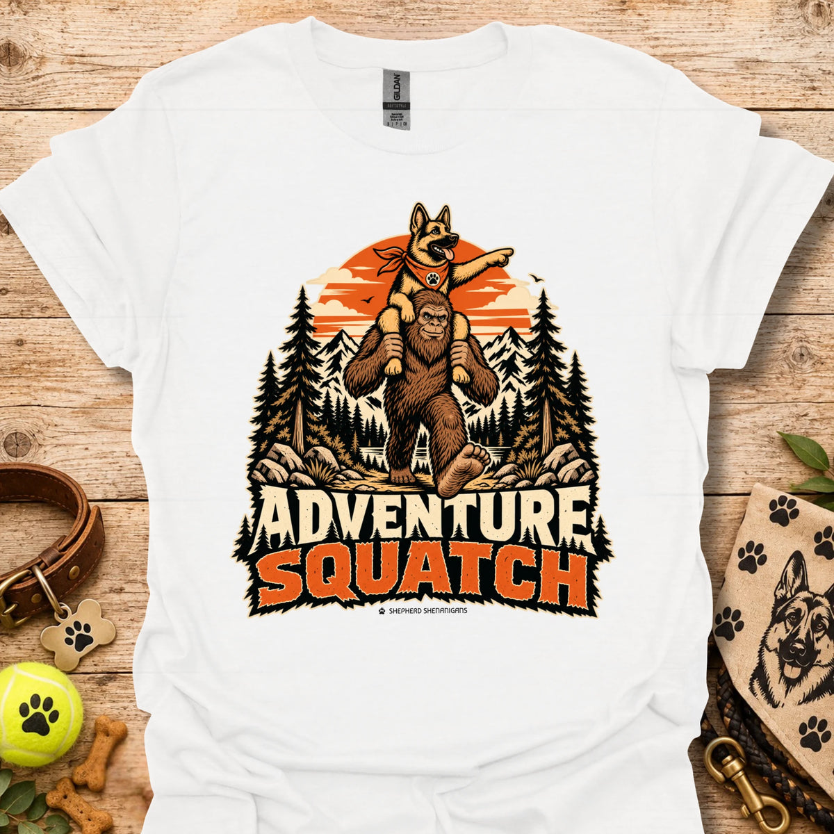 White T-shirt with orange bear and pine tree logo graphic centered on the chest