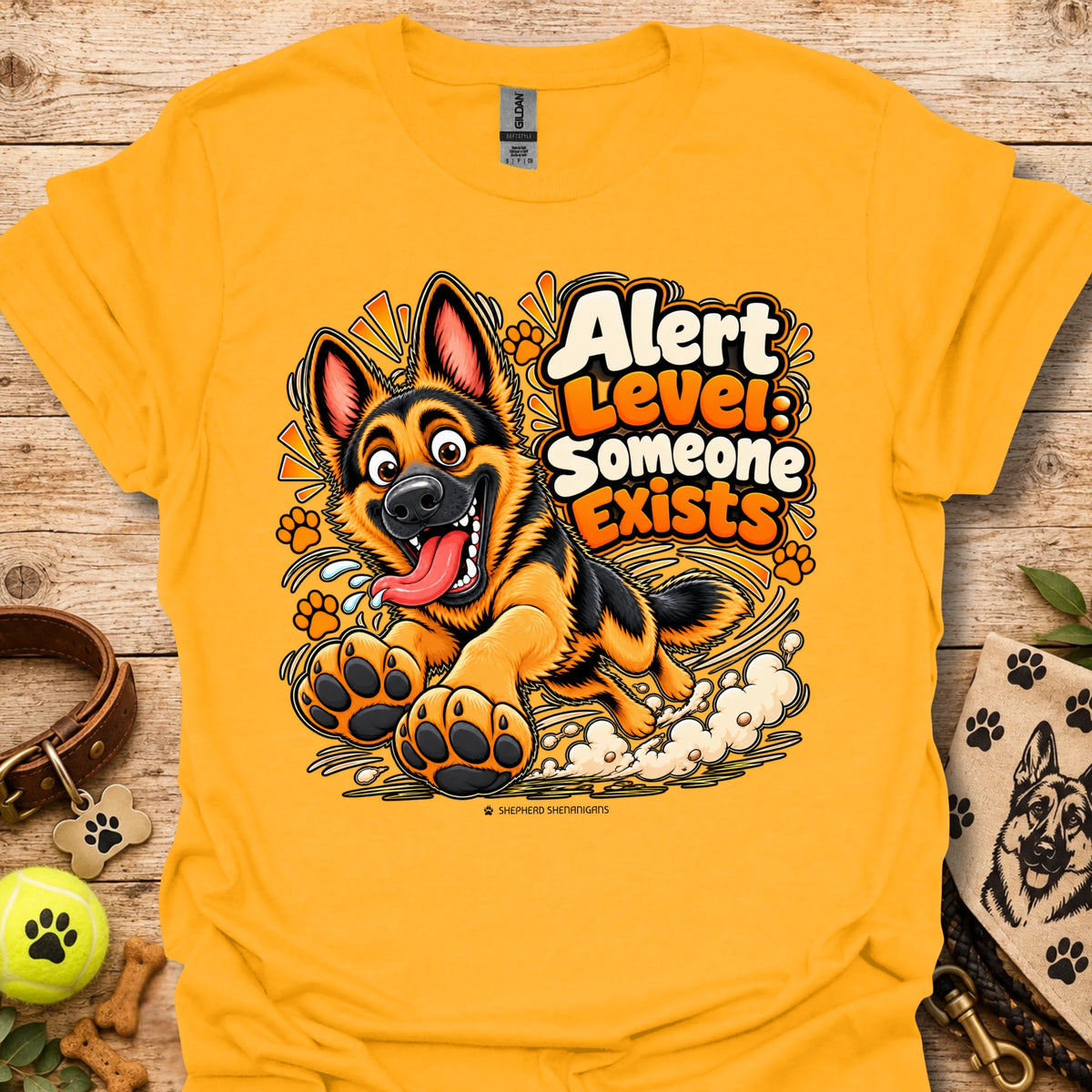 Gold crewneck T-shirt with colorful alert dog graphic and paw prints