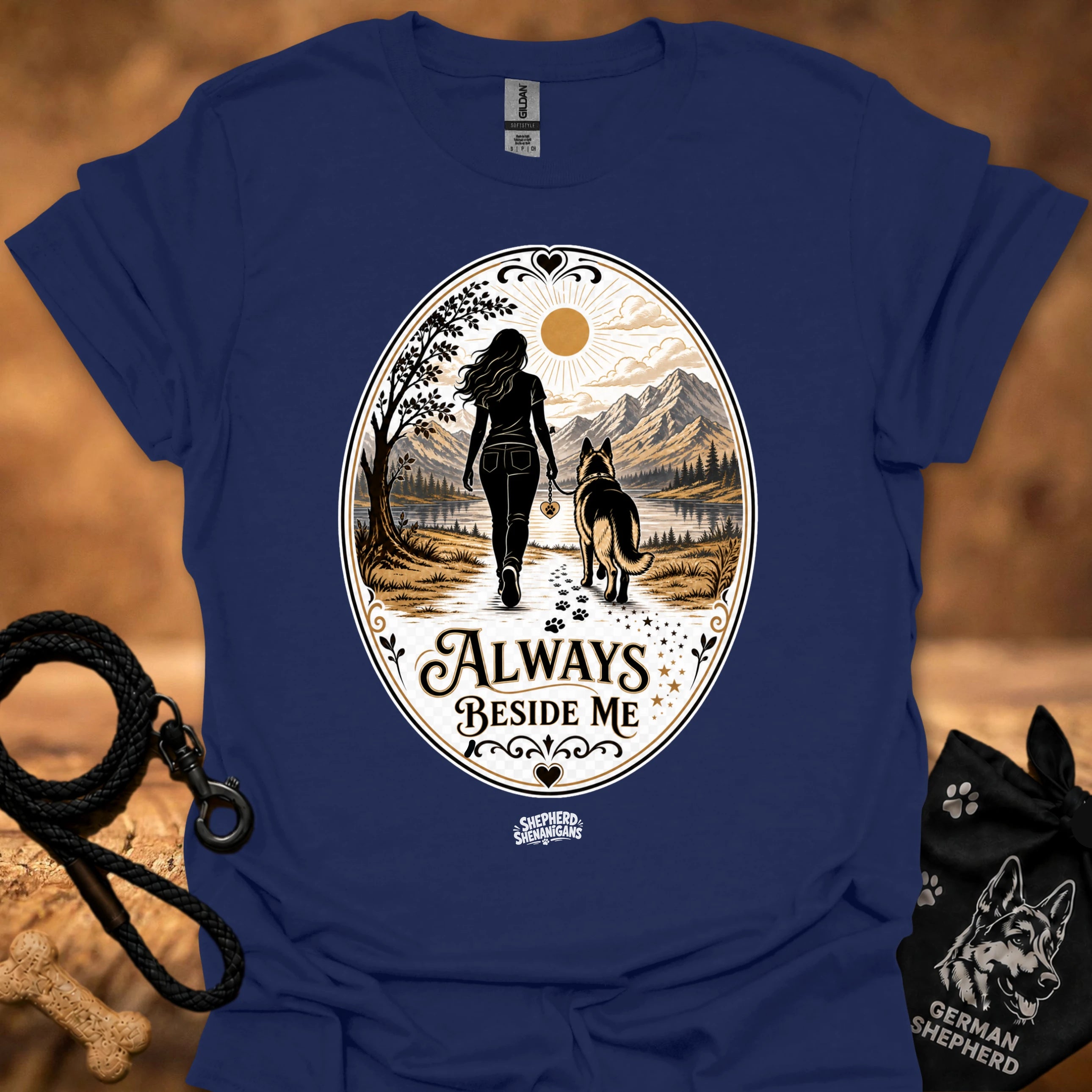 Blue crew-neck T-shirt with round “Always Beside Me” hiker and dog graphic