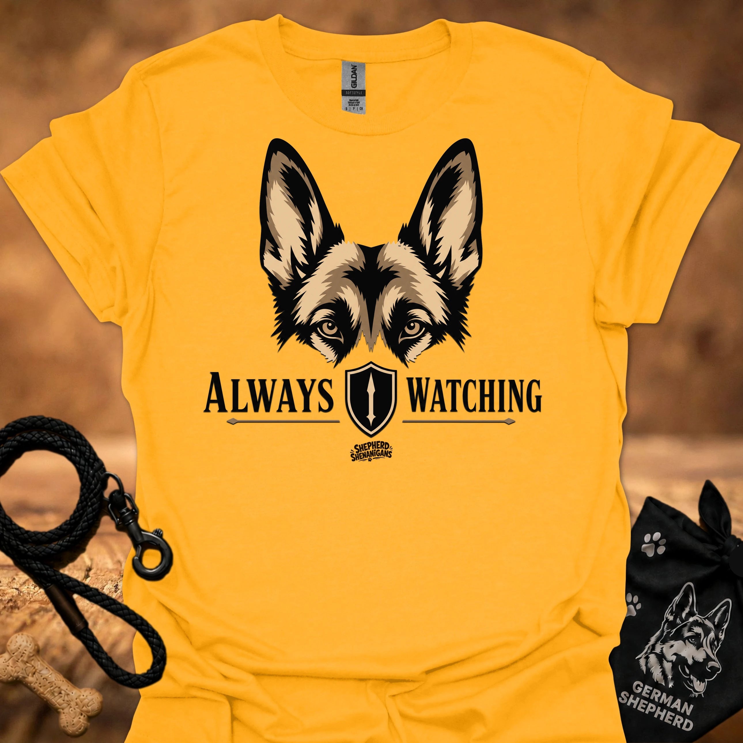 Gold graphic dog face T-shirt with “Always Watching” text and shield icon