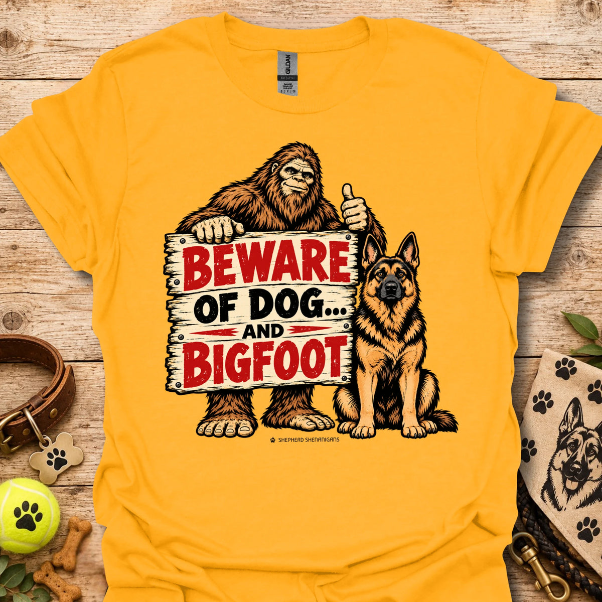 Gold T-shirt with bigfoot and dog warning graphic: BEWARE OF DOG AND BIGFOOT