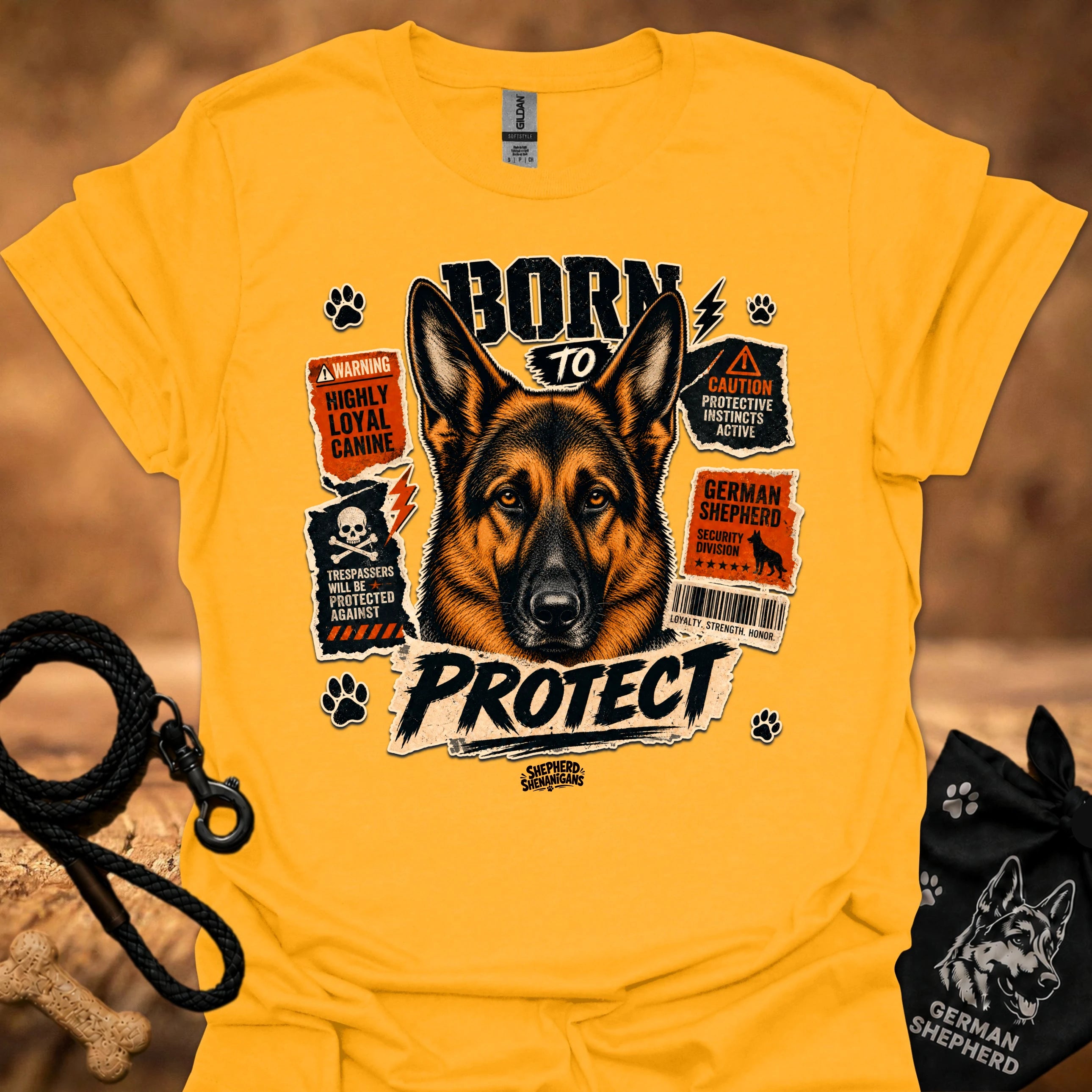 Gold graphic dog T-shirt with 'Born to Protect' text and paw print icons