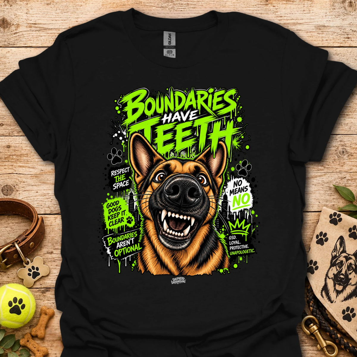 Black T-shirt with colorful dog head graphic and 'Boundaries Have Teeth' text