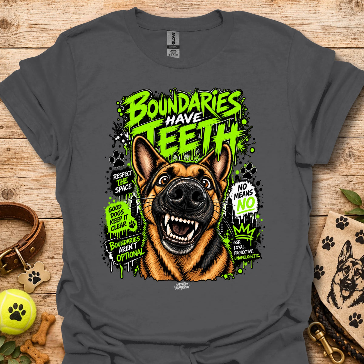 Charcoal T-shirt with colorful dog head graphic and 'Boundaries Have Teeth' text