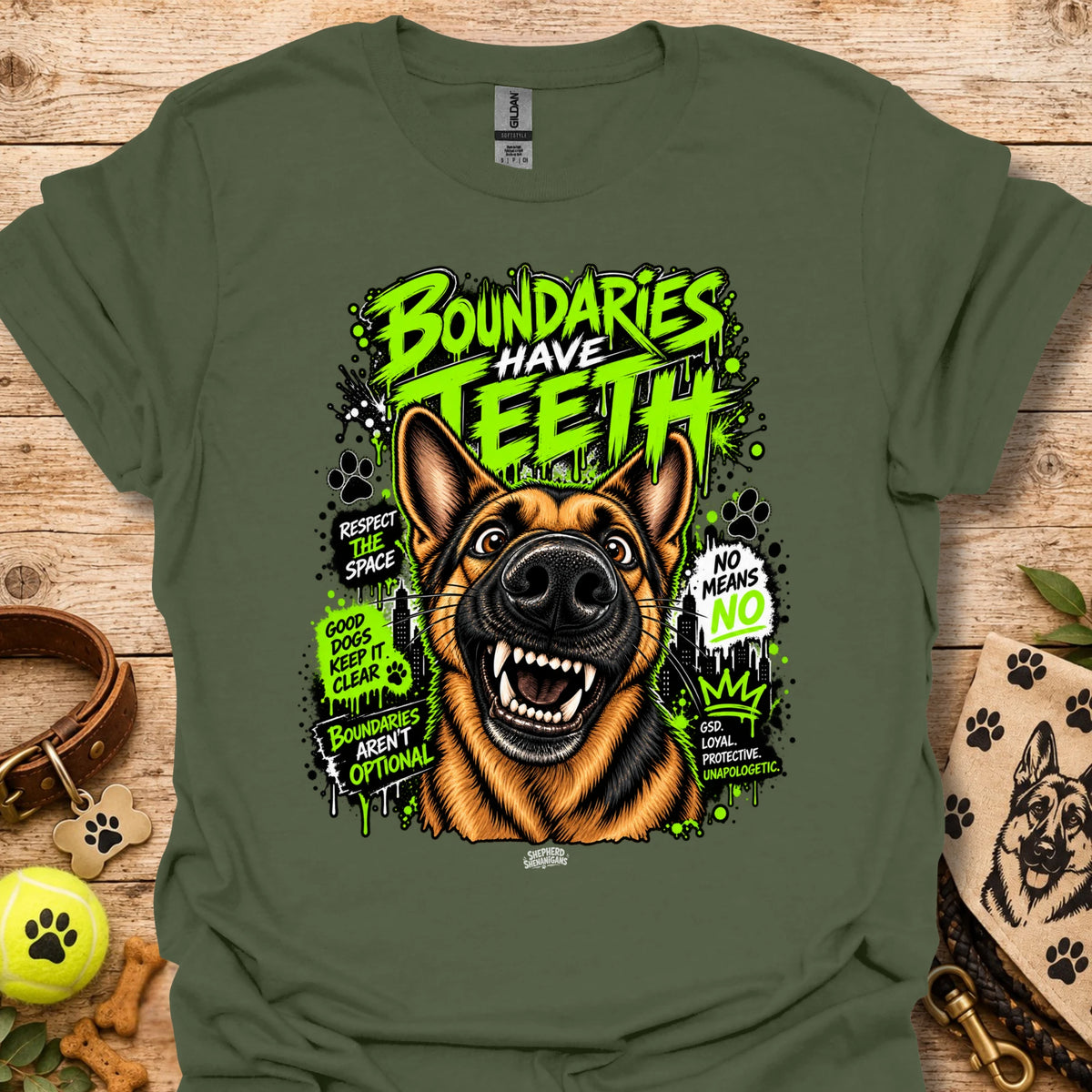 Military green T-shirt with colorful dog head graphic and 'Boundaries Have Teeth' text