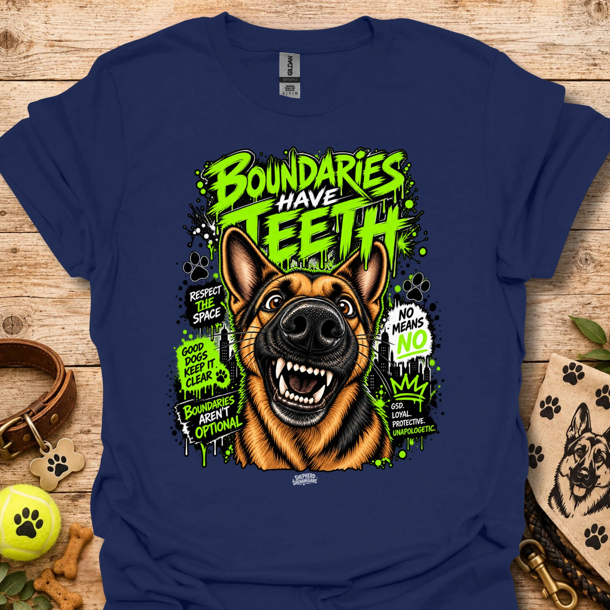 Navy T-shirt with colorful dog head graphic and 'Boundaries Have Teeth' text