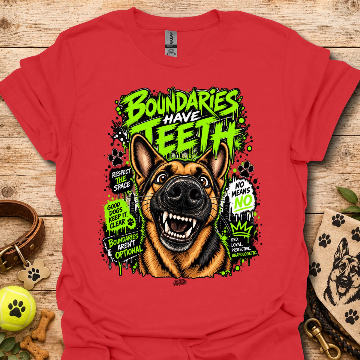 Red T-shirt with colorful dog head graphic and 'Boundaries Have Teeth' text