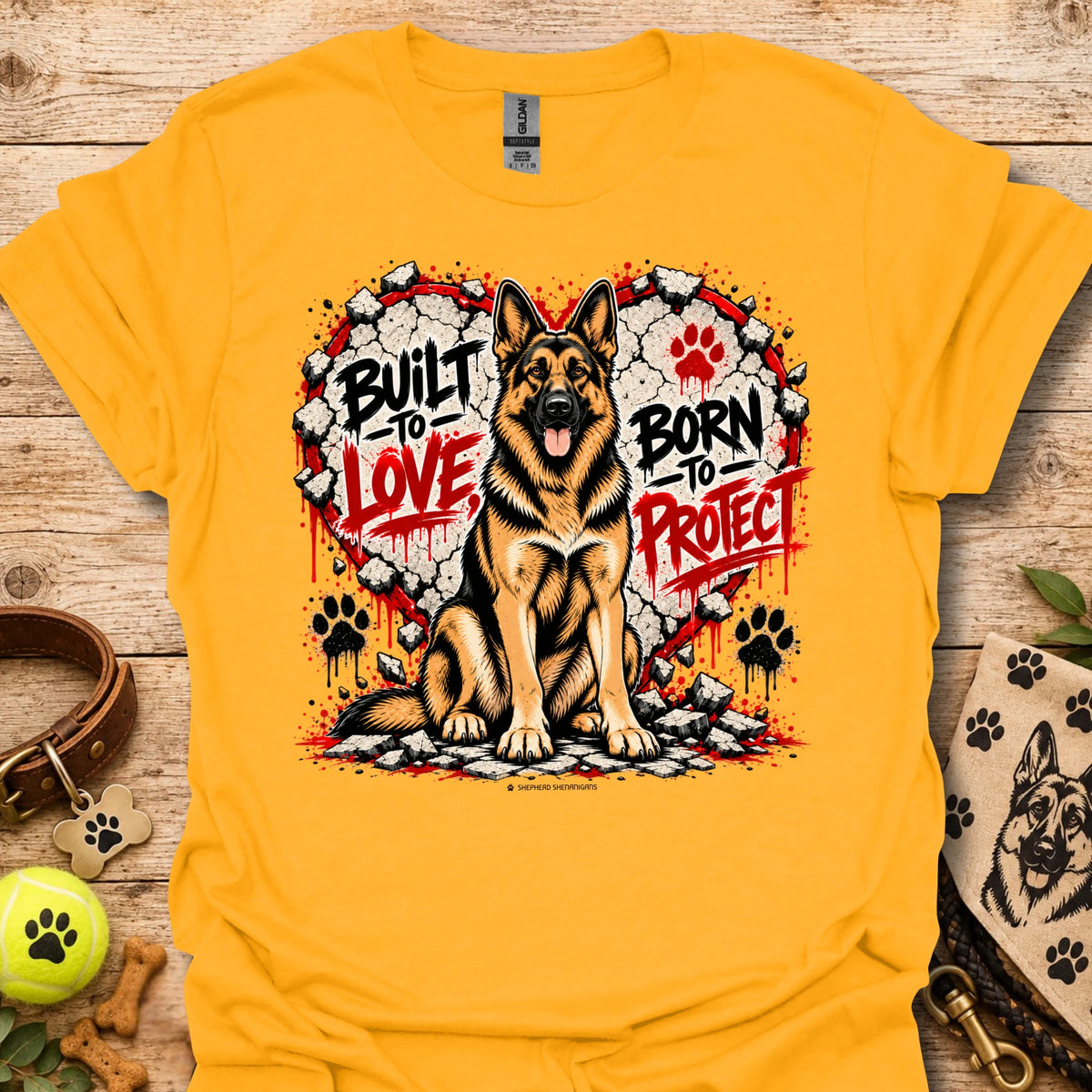 Gold T-shirt with German shepherd dog graphic and red/black paw prints wreath