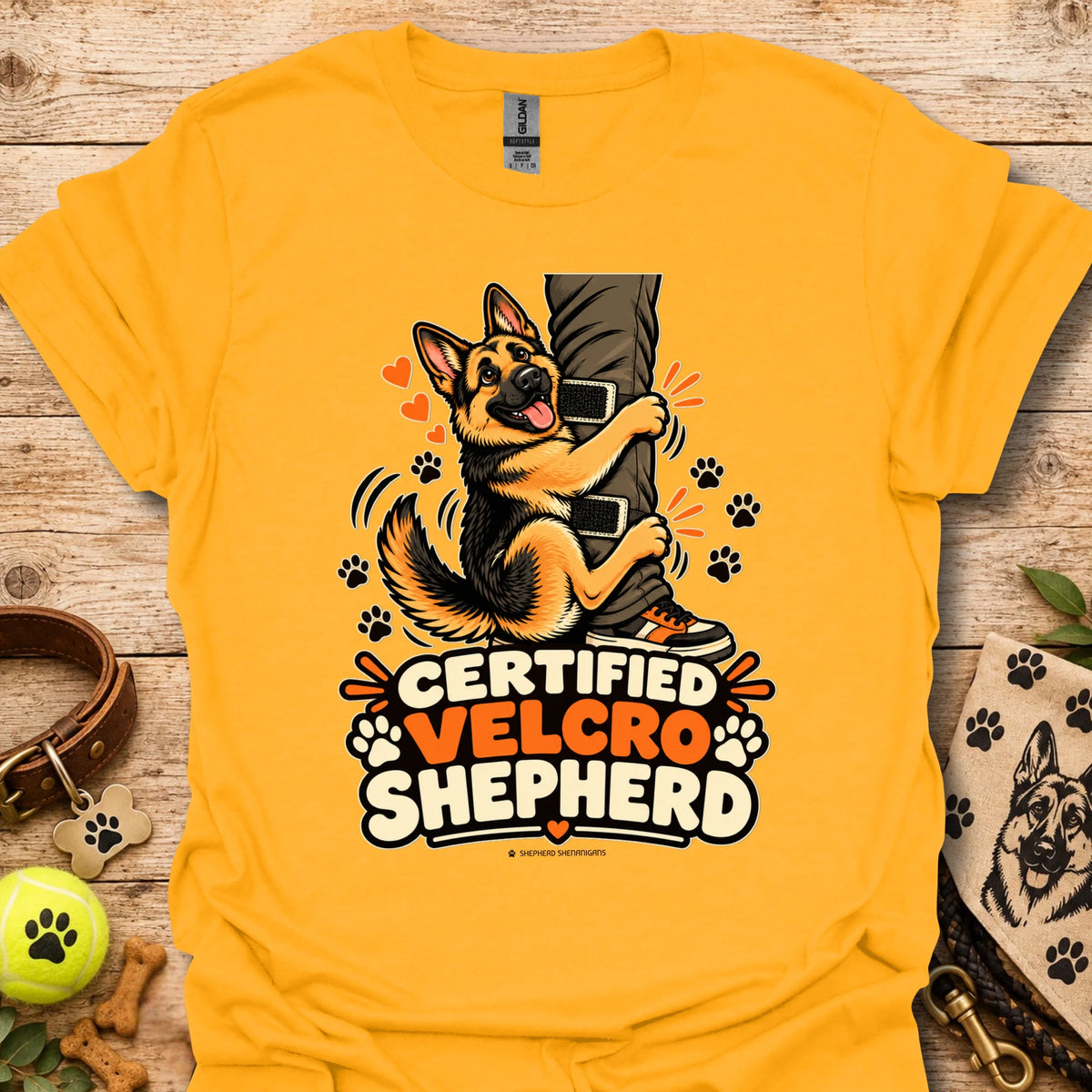 Gold/yellow T-shirt with “Certified Velcro Shepherd” dog graphic on the front