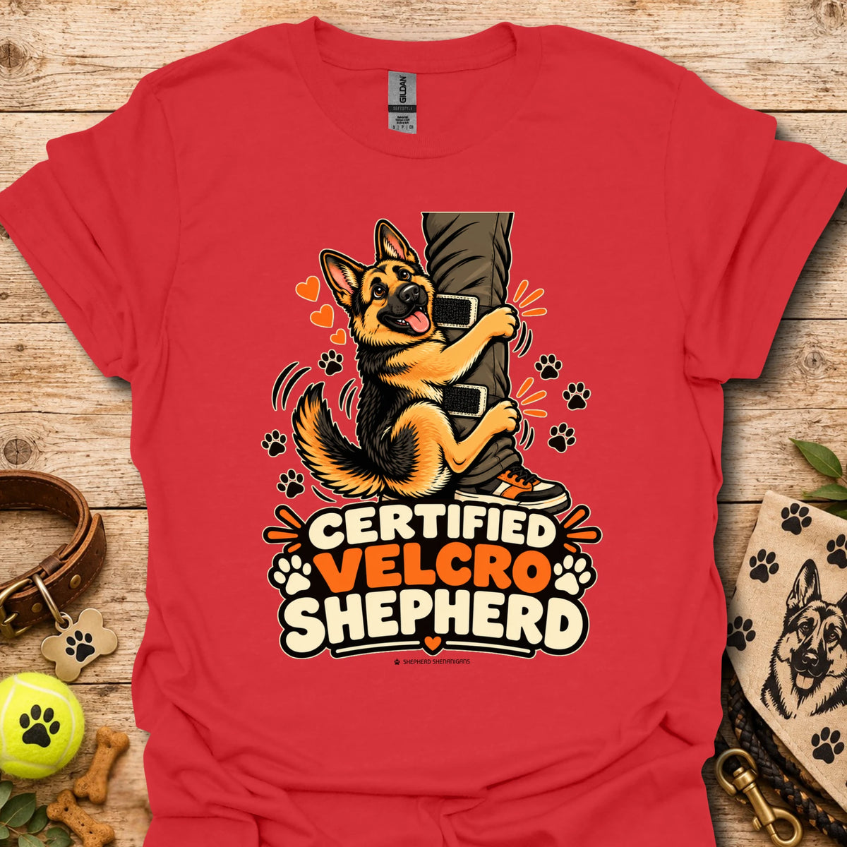 Red T-shirt with “Certified Velcro Shepherd” dog graphic on the front