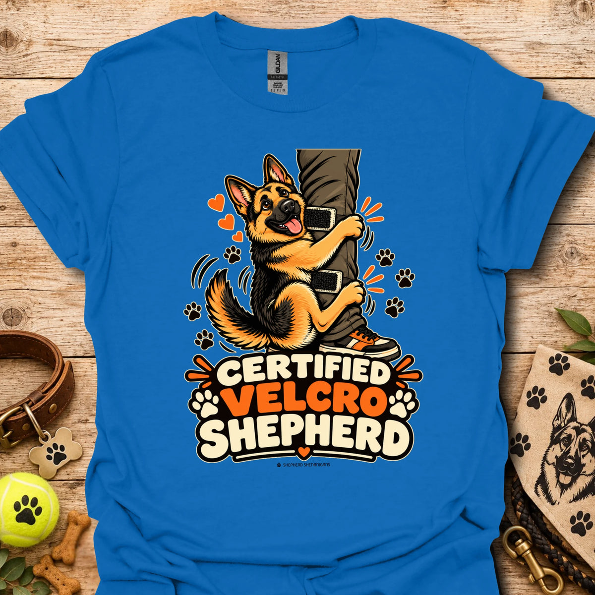 Royal blue T-shirt with “Certified Velcro Shepherd” dog graphic on the front