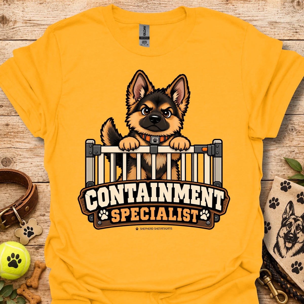 Gold crewneck t-shirt with cartoon dog behind fence graphic and bold text logo