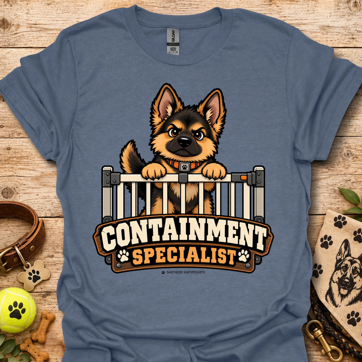 Slate blue crewneck t-shirt with cartoon dog behind fence graphic and bold text logo
