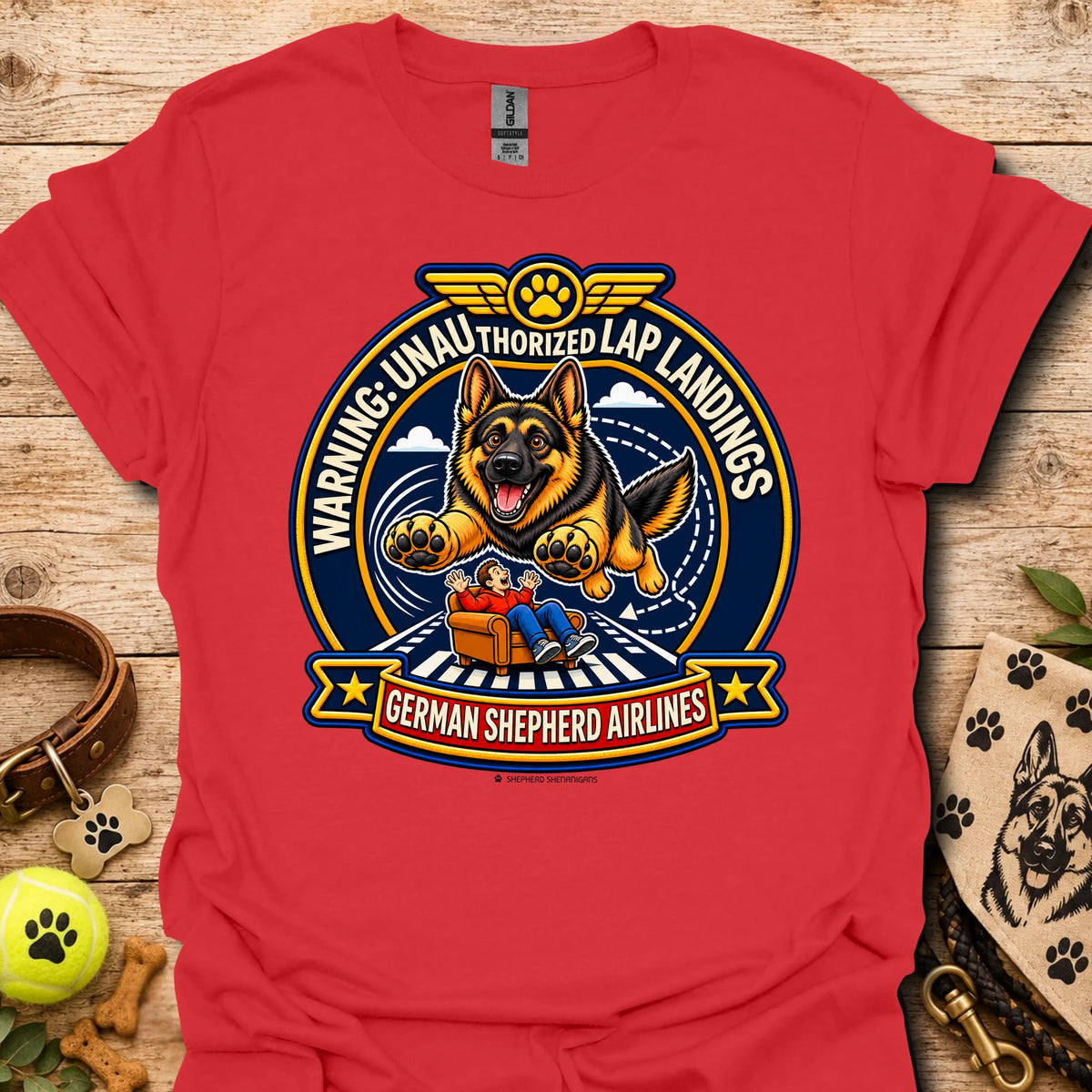 Red T-shirt with a German shepherd airline badge graphic and lap-landing warning