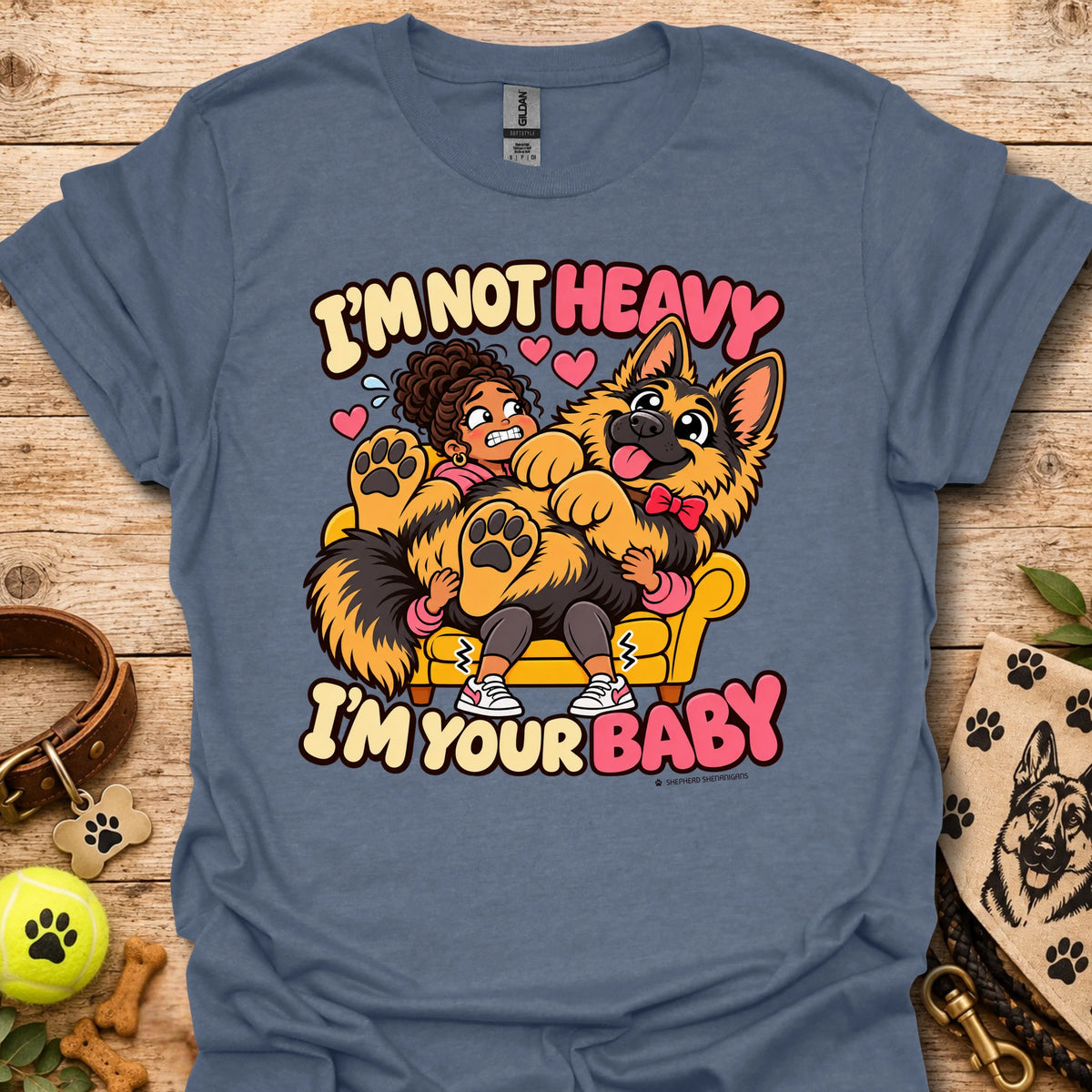 Heather indigo T-shirt with a colorful child and dog graphic and “I'm Not Heavy I'm Your Baby” text