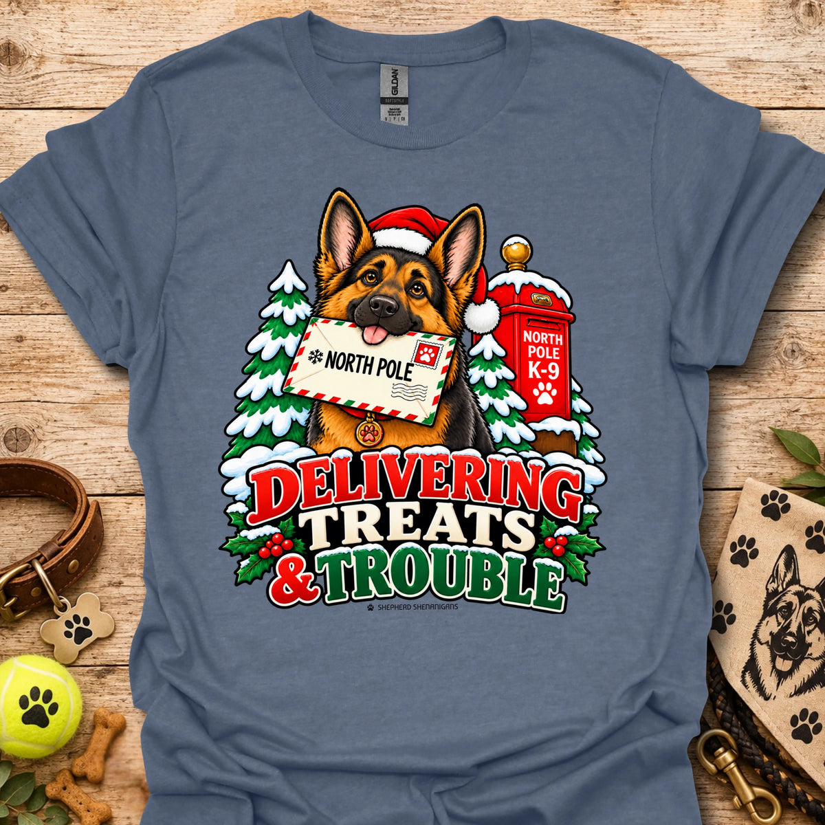 Heather indigo T-shirt with colorful dog and holiday "Delivering Treats & Trouble" graphic