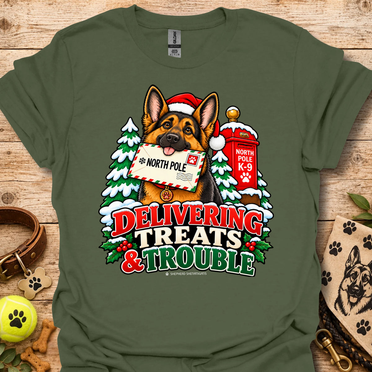 Military green T-shirt with colorful dog and holiday "Delivering Treats & Trouble" graphic